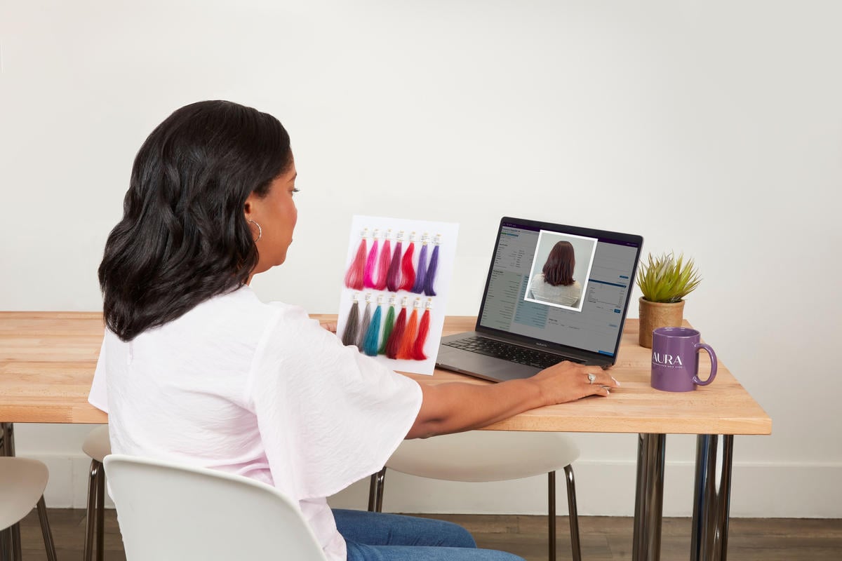 colorist reviewing customer image on a computer