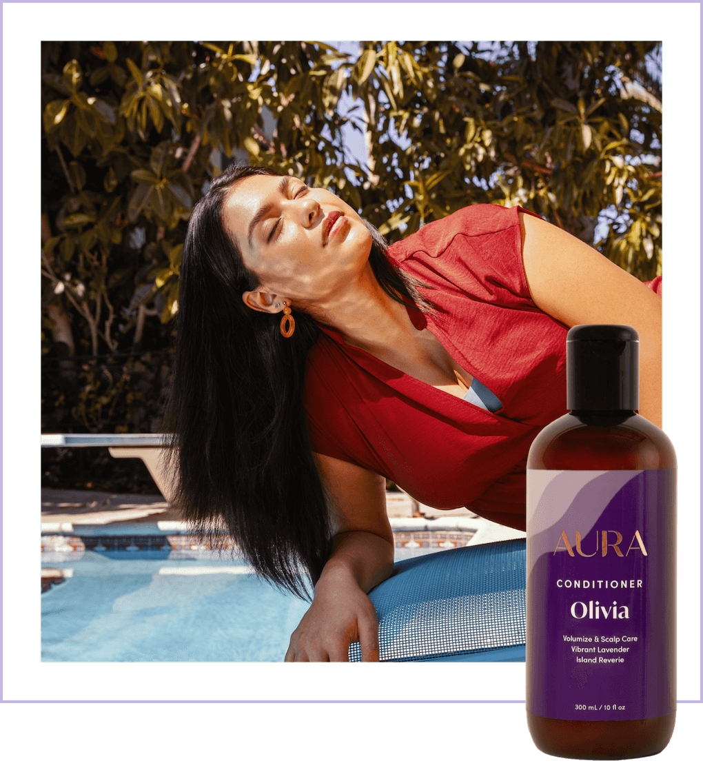 Woman with long black hair lying on a pool chair